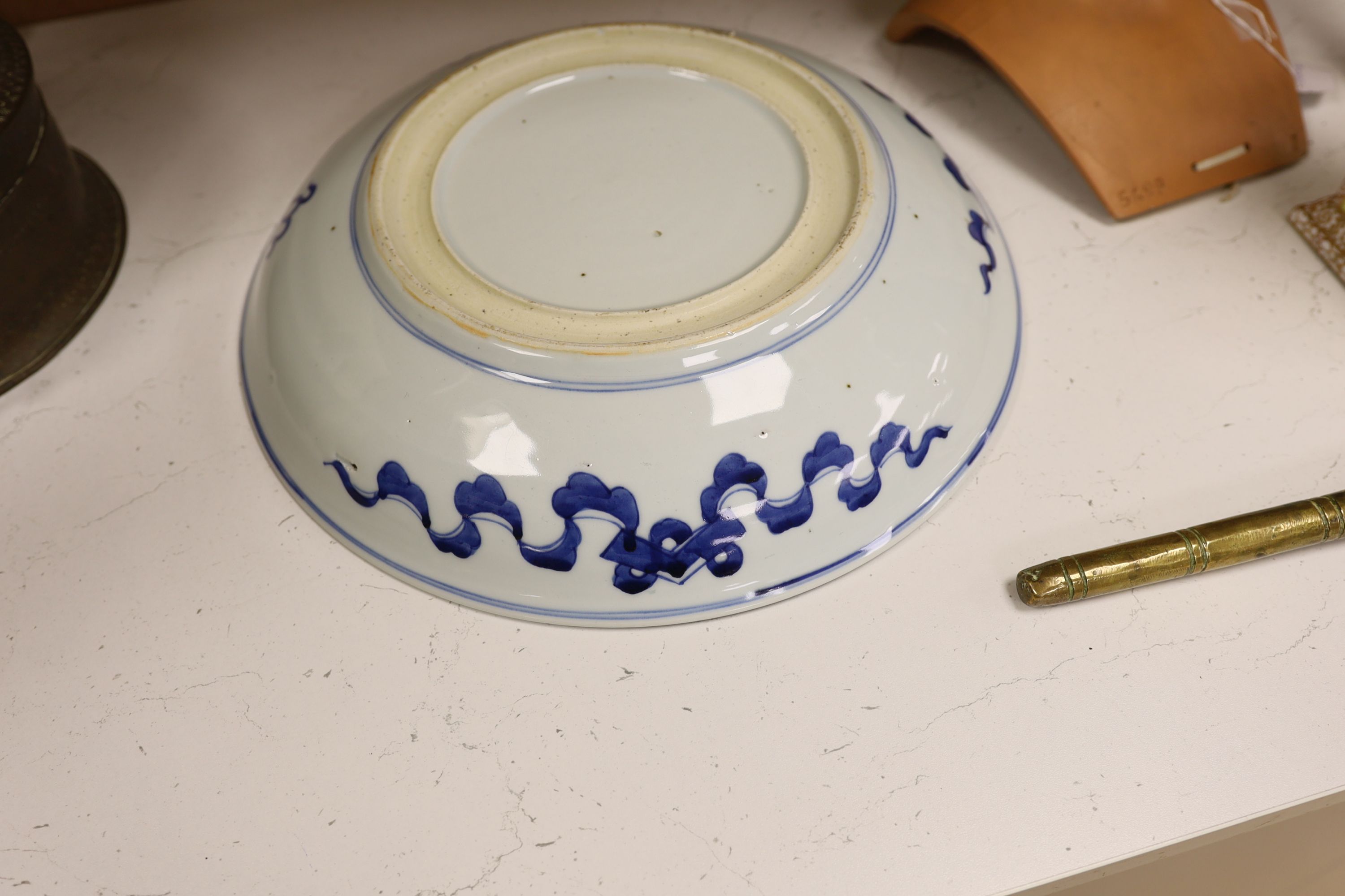 A Chinese blue and white ‘Buddhist lion’ dish, channel moulded foot, 36cm diameter